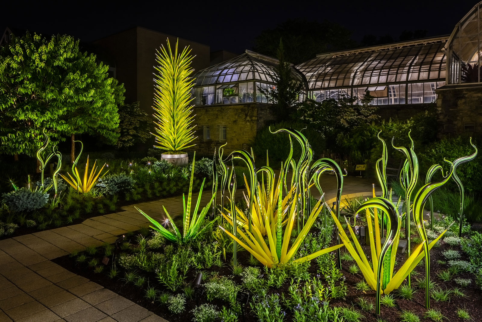 Black and Green Striped Herons and Green Grass and Lime Green Icicle Tower by Dale Chihuly