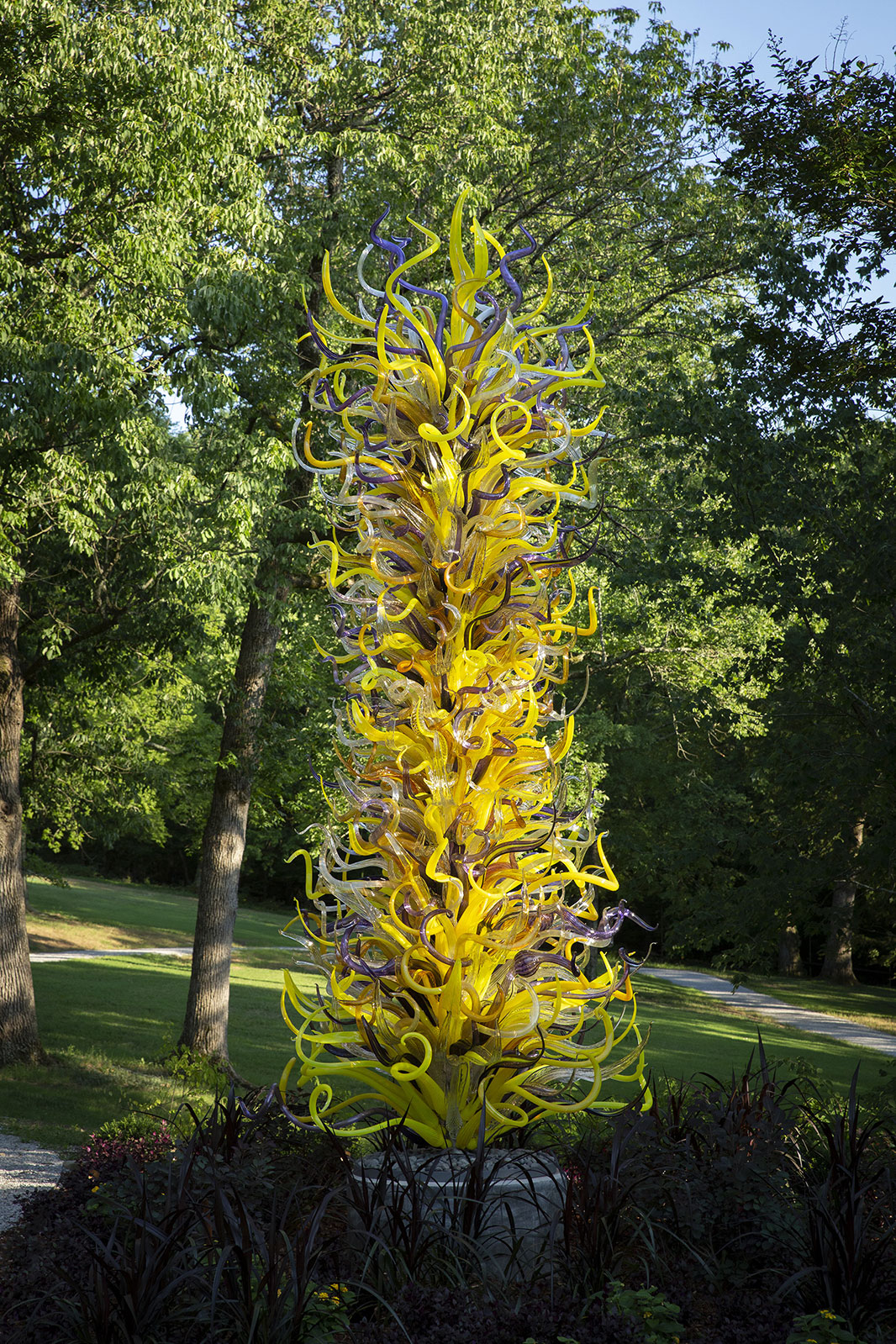 Gilded Yellow and Plum Tower (2019) by Dale Chihuly